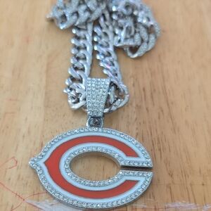 Unk Silver-tone Pendant Necklace with Orange and White Team Emblem